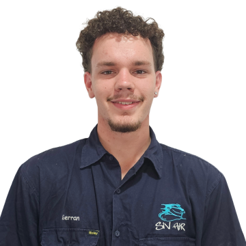 A man wearing a shirt that says ' snake ' on it