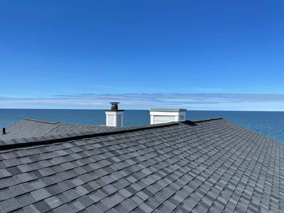 Worker Installing Metal Sheet Roof - Grand Haven, MI - Lakeside Roofing Company