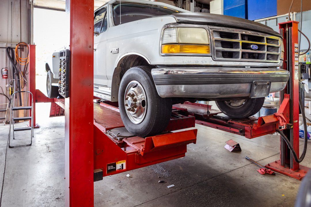 Coffey Automotive truck on lift in St.Charles, MO at Coffey Automotive