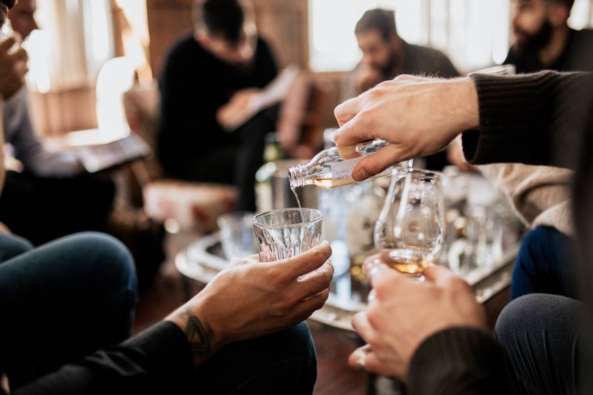 A group of people tasting whisky at Kentucky River Tours near Frankfort, KY