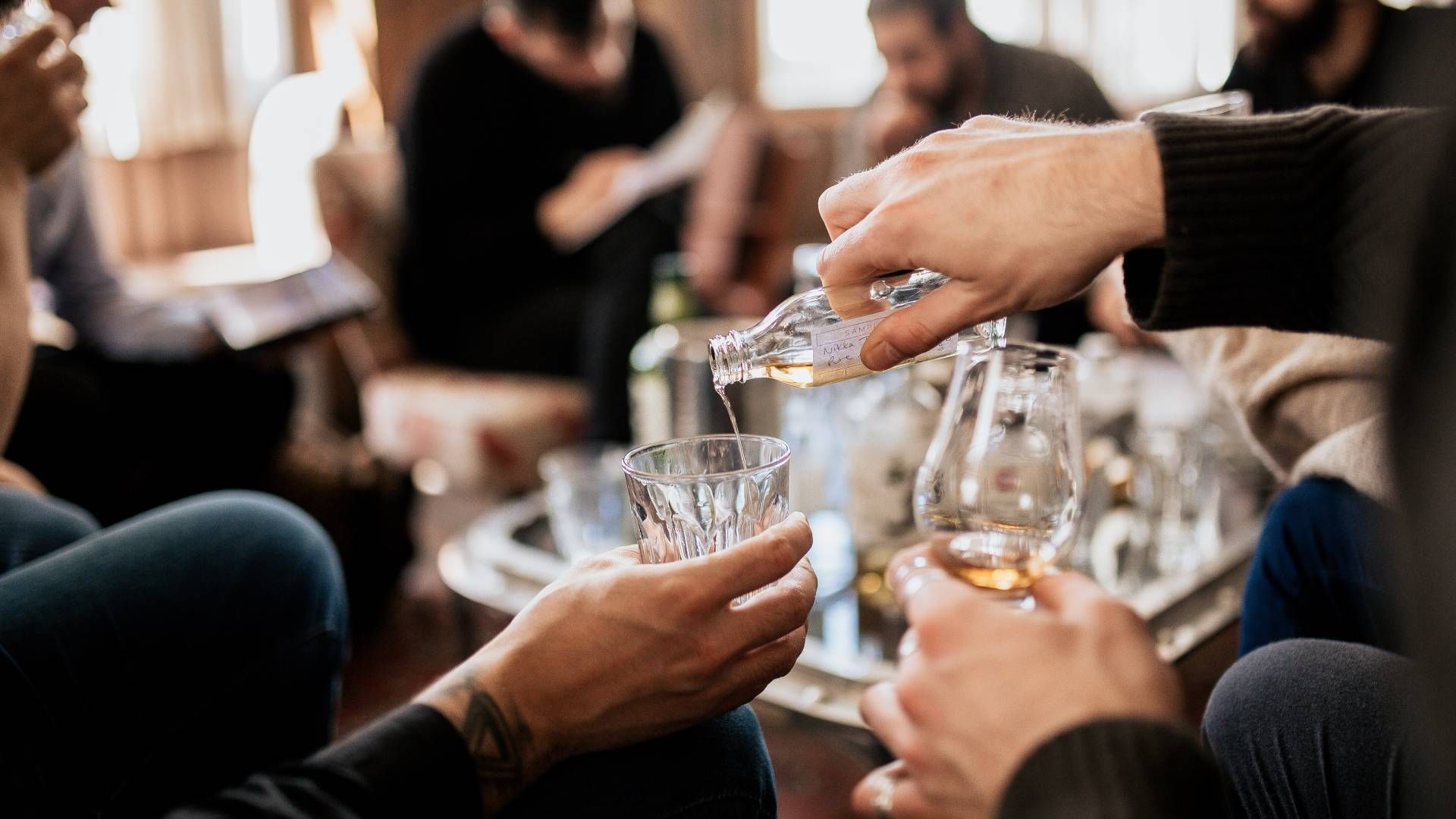 A group of people tasting whisky at Kentucky River Tours near Frankfort, KY