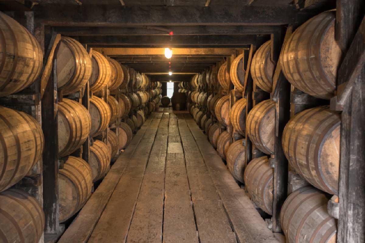 Bourbon distillery with rows of bourbon barrels near Frankfort, KY