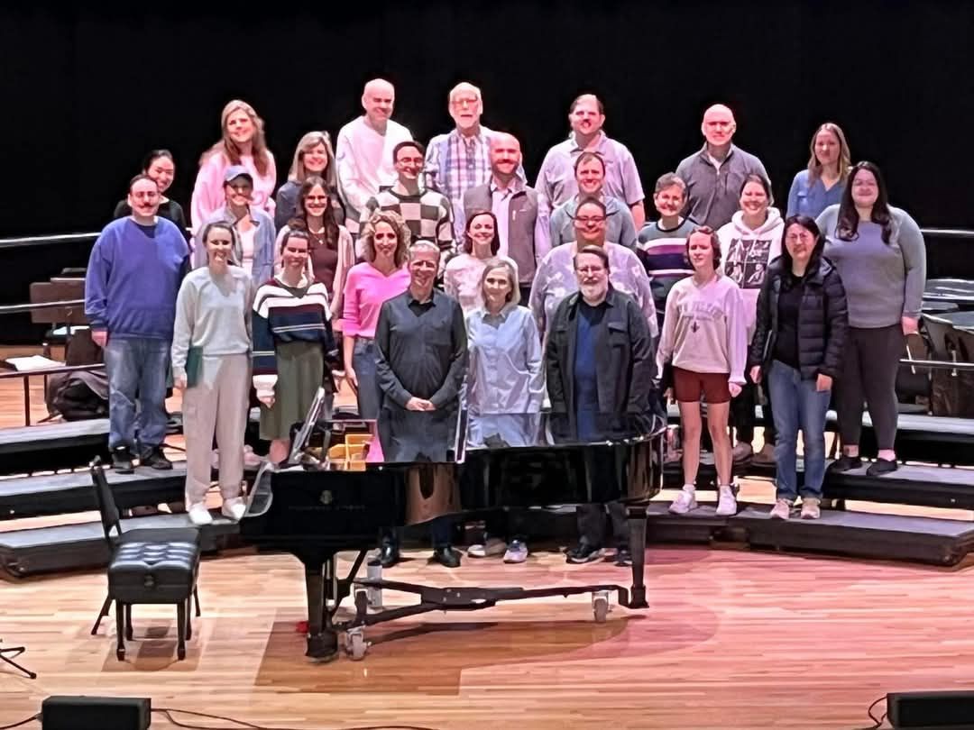 A group of people are posing for a picture in a church.