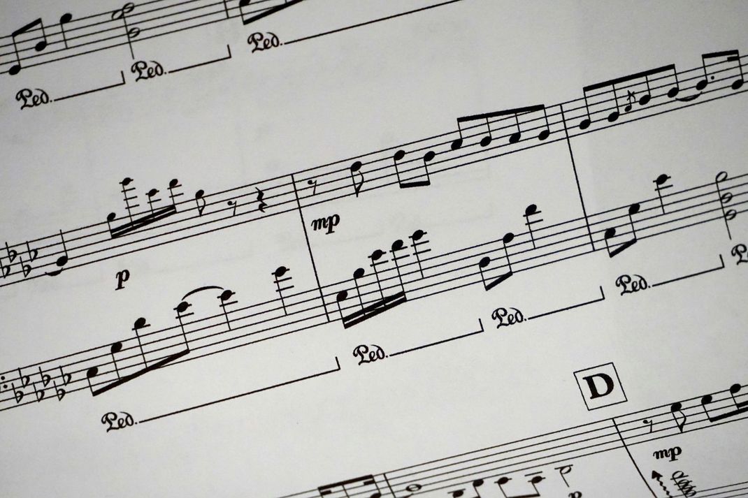 A sheet of music with the letter d in the middle