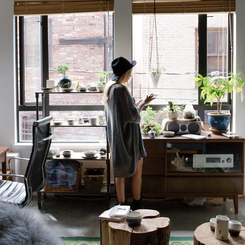 mortgage planning, woman listening to music, plants
