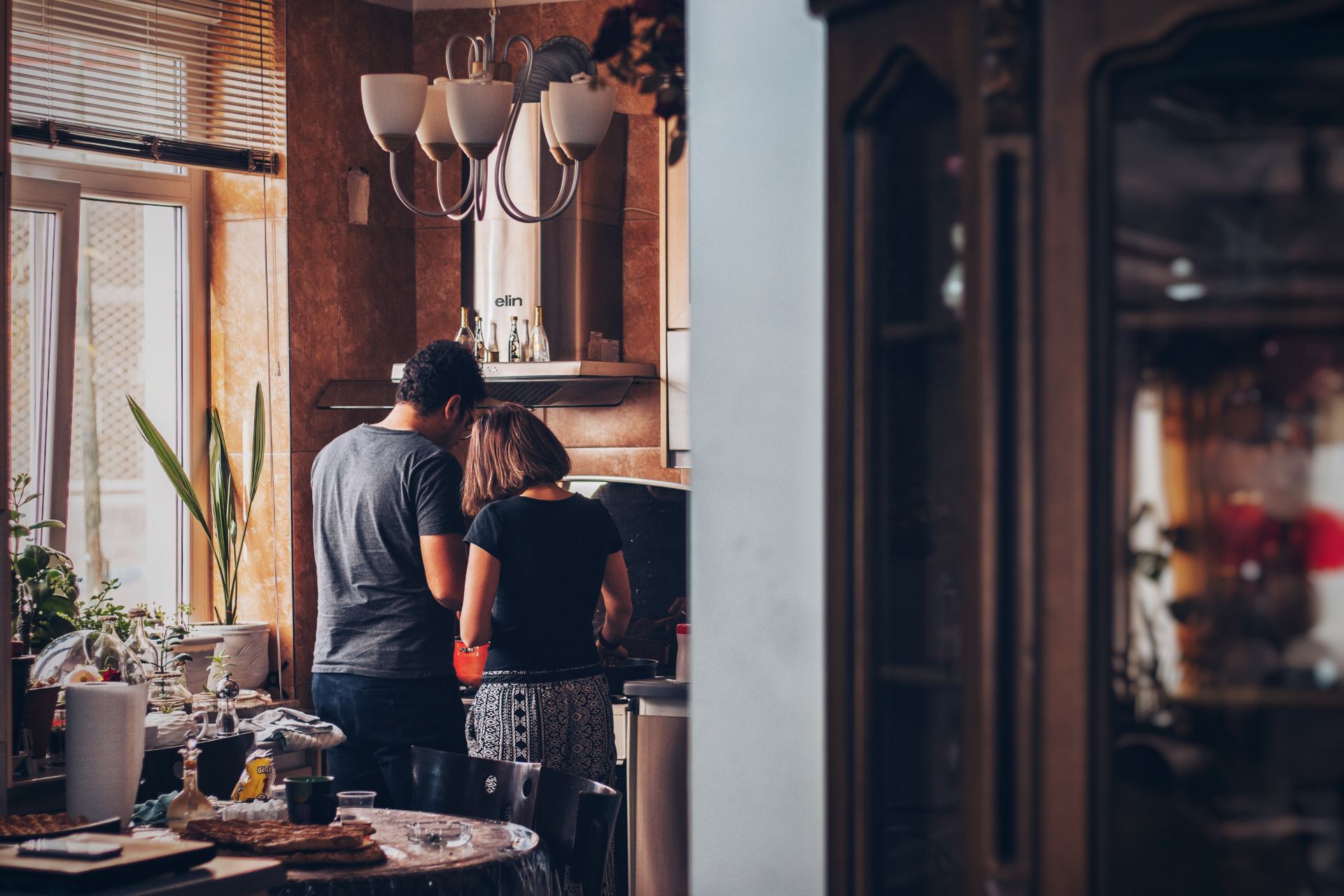 two people making diner in apartment