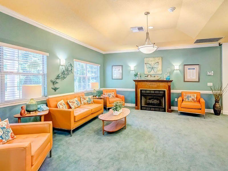 A living room filled with furniture and a fireplace.