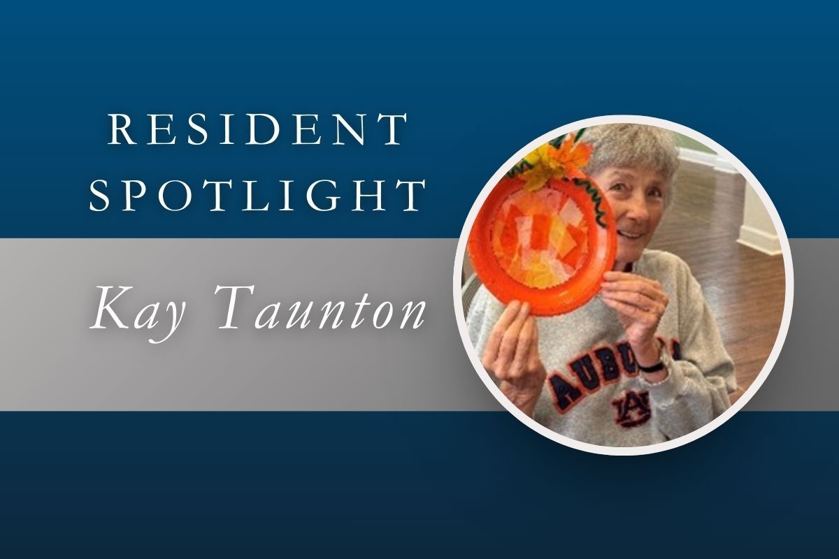 Resident Spotlight: Kay Taunton holding a pumpkin-shaped dish with a smile, against a blue and gray background.