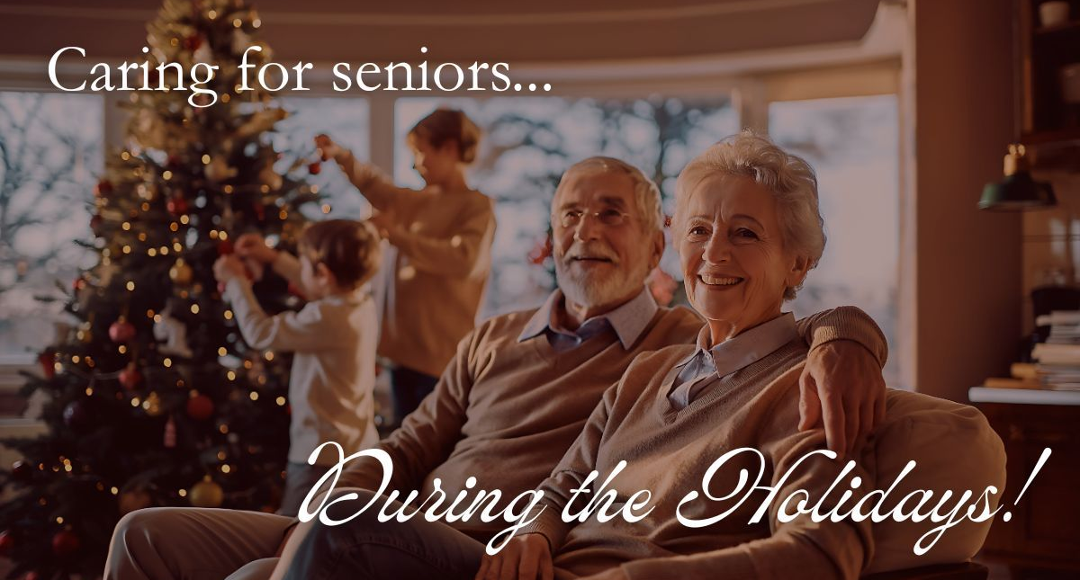 Elderly couple smiles with family, decorating a Christmas tree. 