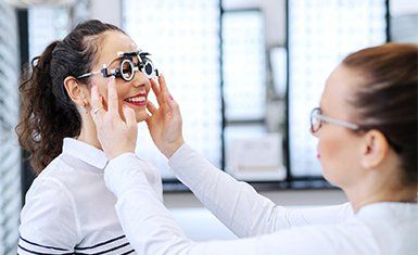 Comprehensive Eye Examination — Woman Fitting Eyeglasses in Danville, KY