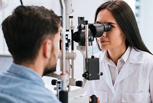 Pediatric & Adult Eye Care — Man During Eye Examination in Danville, KY