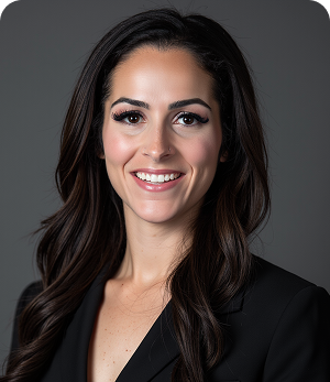A woman with long dark hair is smiling and wearing a black jacket.