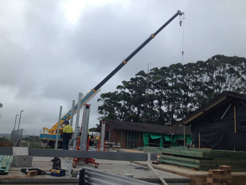 A Crane is Being Used to Lift a Large Piece of Metal — North Coast Steel Fabrication in South Lismore, NSW