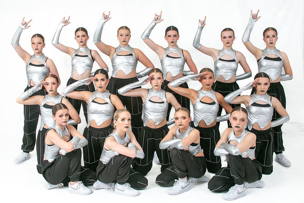 A group of young women are posing for a picture.