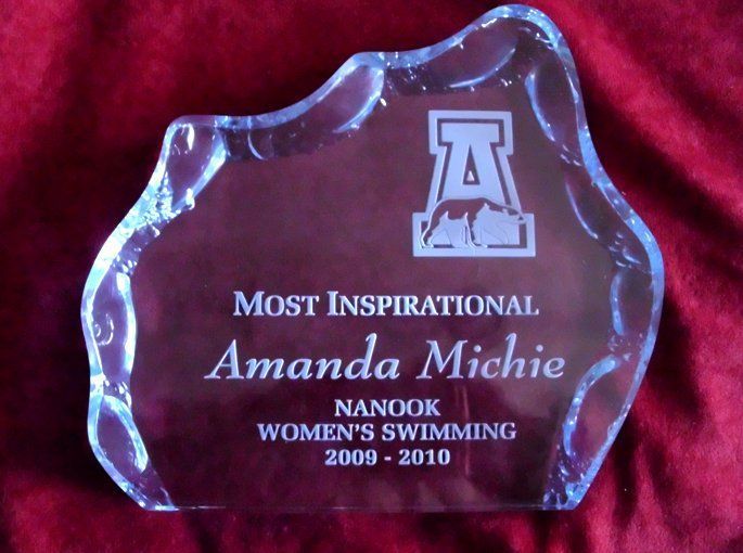 A glass plaque that says most inspirational amanda michie