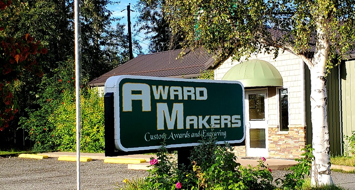 A sign for award makers is in front of a building