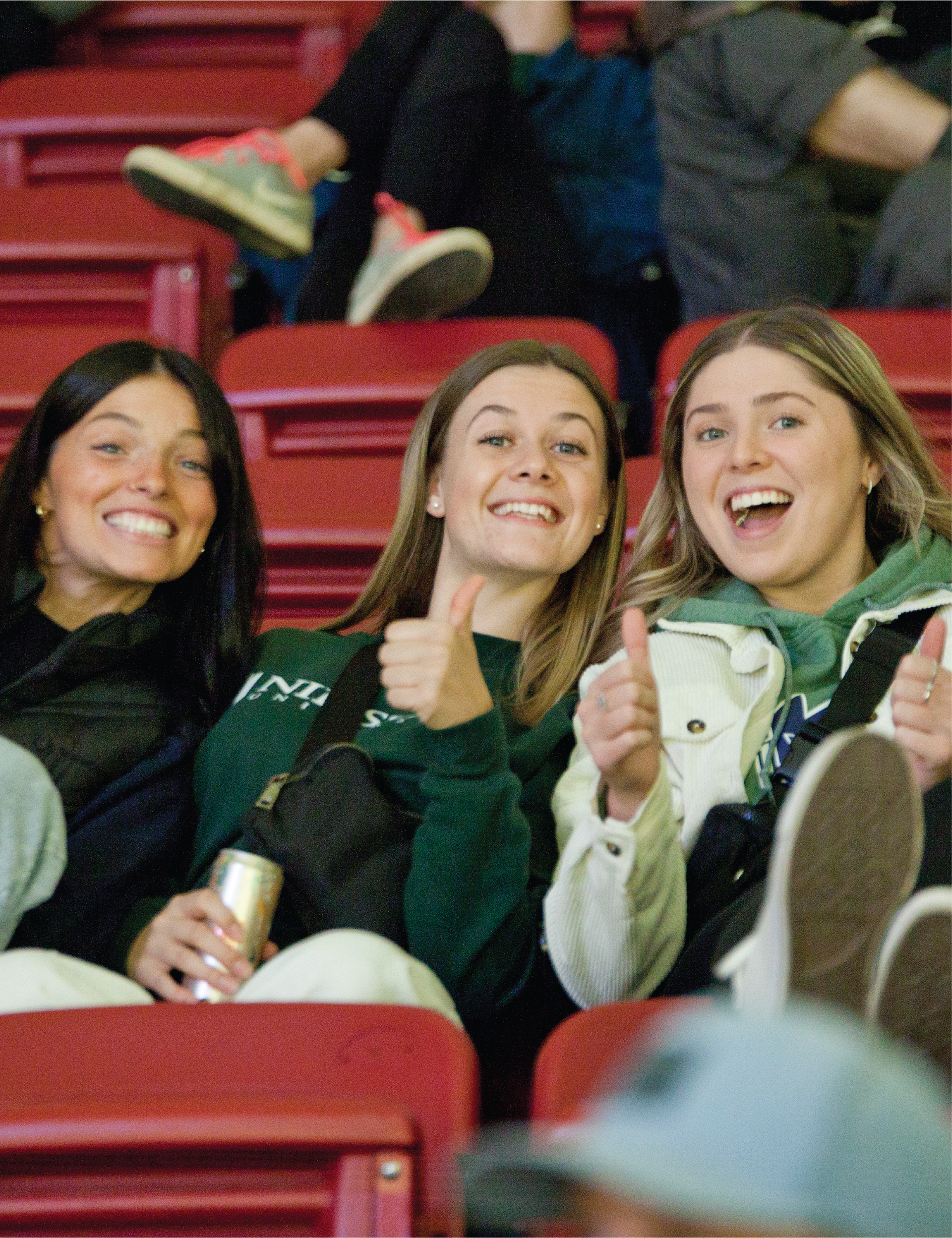 3 students giving a thumbs up