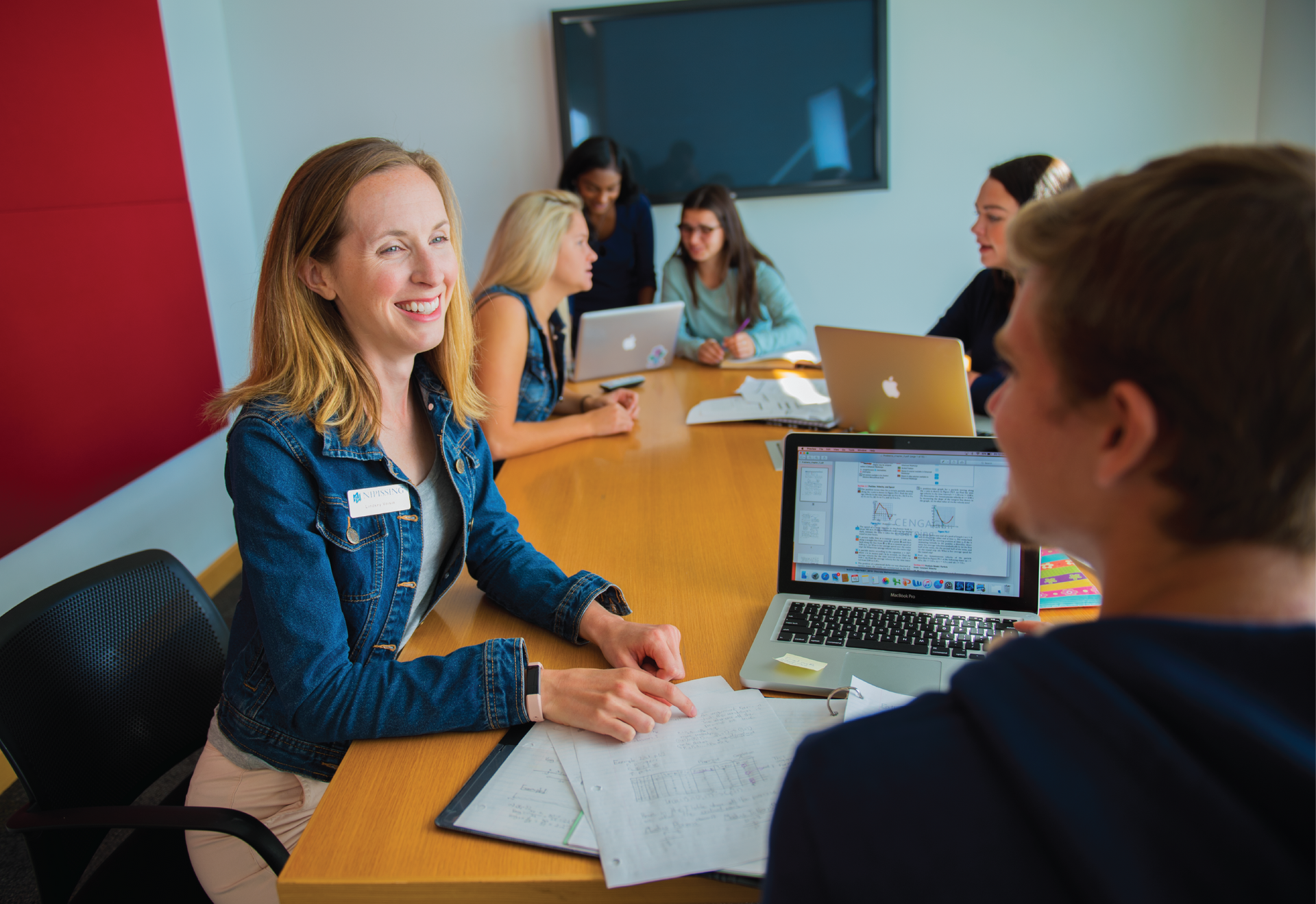 an employee talking to a student