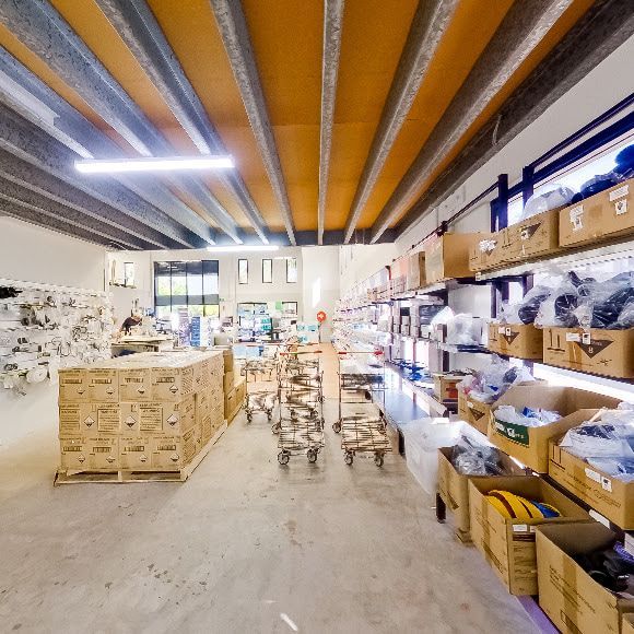 A Warehouse Filled with Lots of Boxes and Carts — Poolside Noosa in Noosaville, QLD