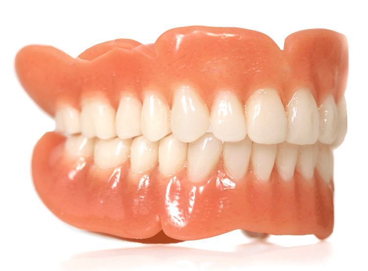 A set of dentures with pink gums and white teeth.