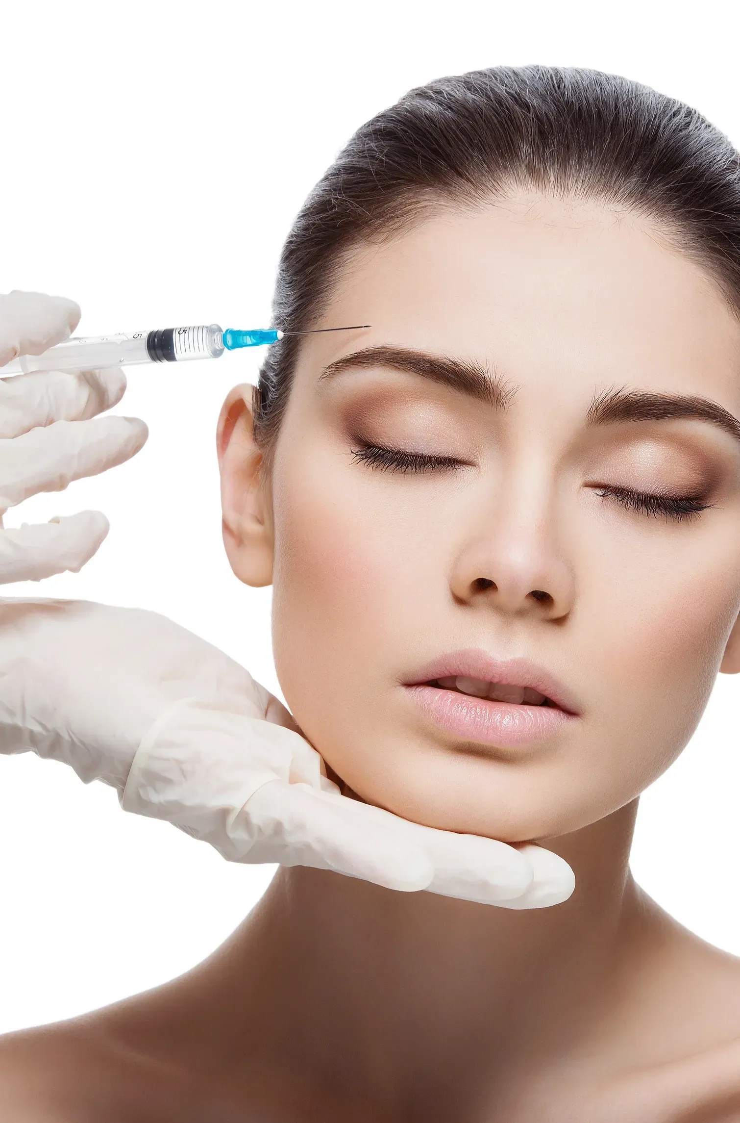 A woman is getting a botox injection in her forehead.