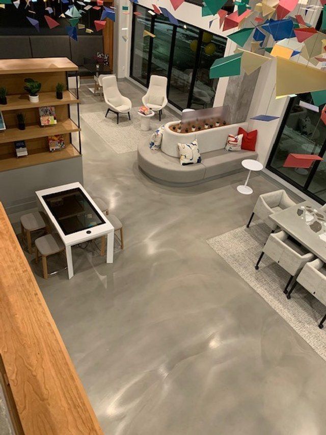 An aerial view of a living room with a table and chairs.