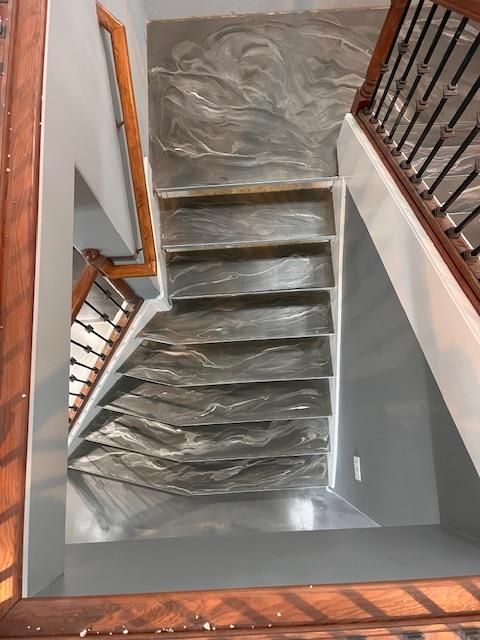 An aerial view of a staircase with plastic covering the steps