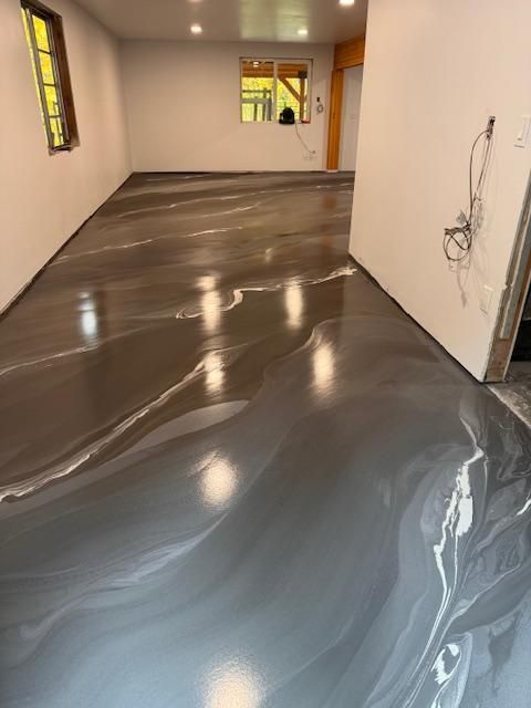 A room with a gray floor and white walls.