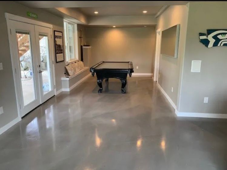 There is a pool table in the middle of the room.
