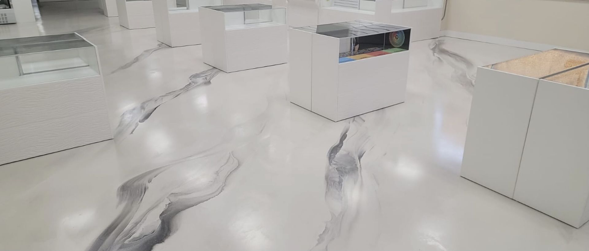 A room with a white floor and a black and white design on it.