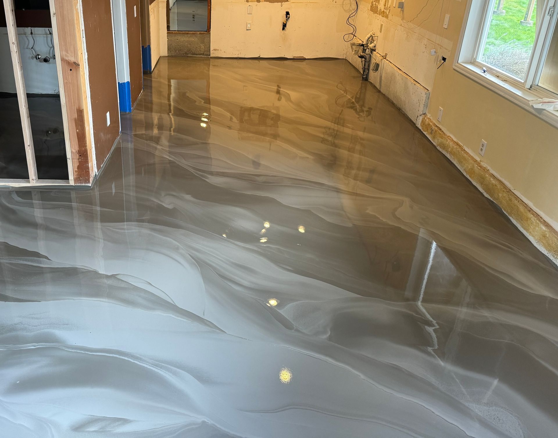 A room with a shiny floor that looks like marble.