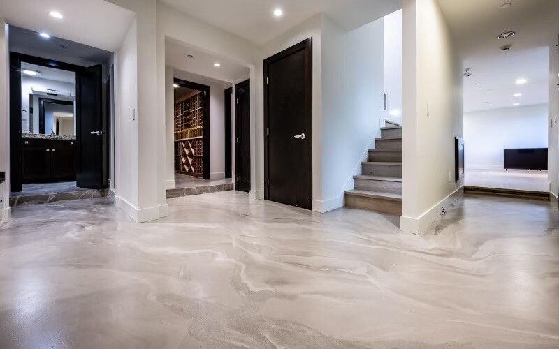 A hallway with stairs leading up to the second floor of a house.