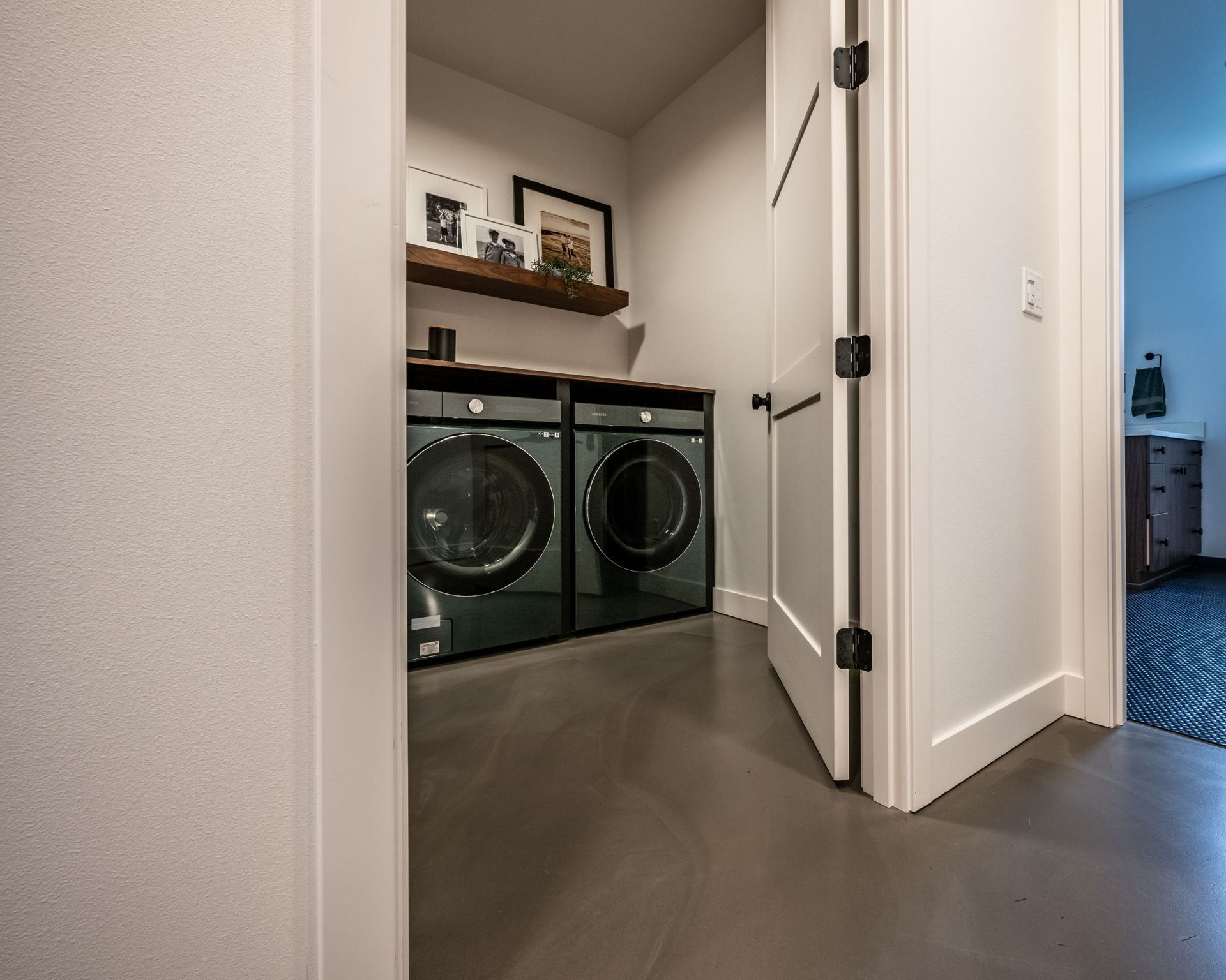 A laundry room with a washer and dryer in it