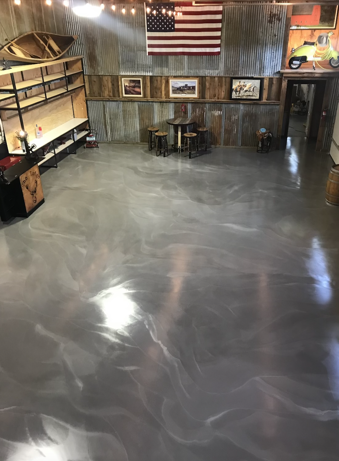 An aerial view of a garage with a shiny metallic floor.