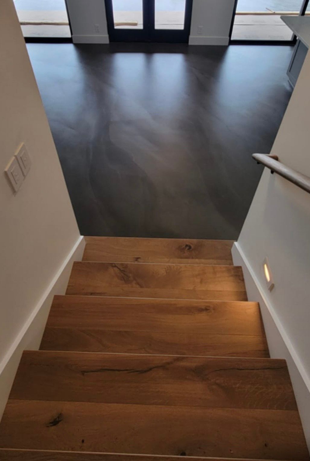 A wooden staircase leading up to the second floor of a house.