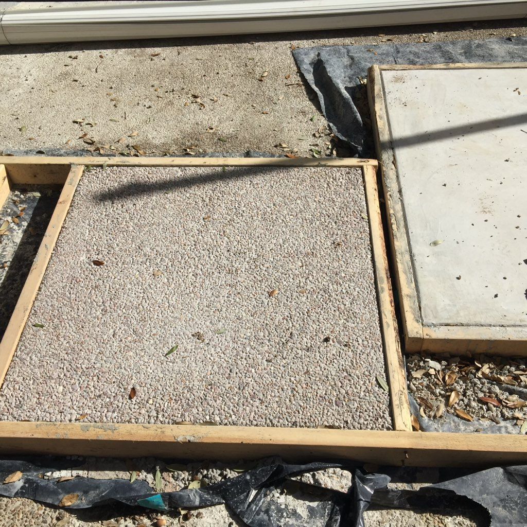 A wooden frame with a concrete slab in it