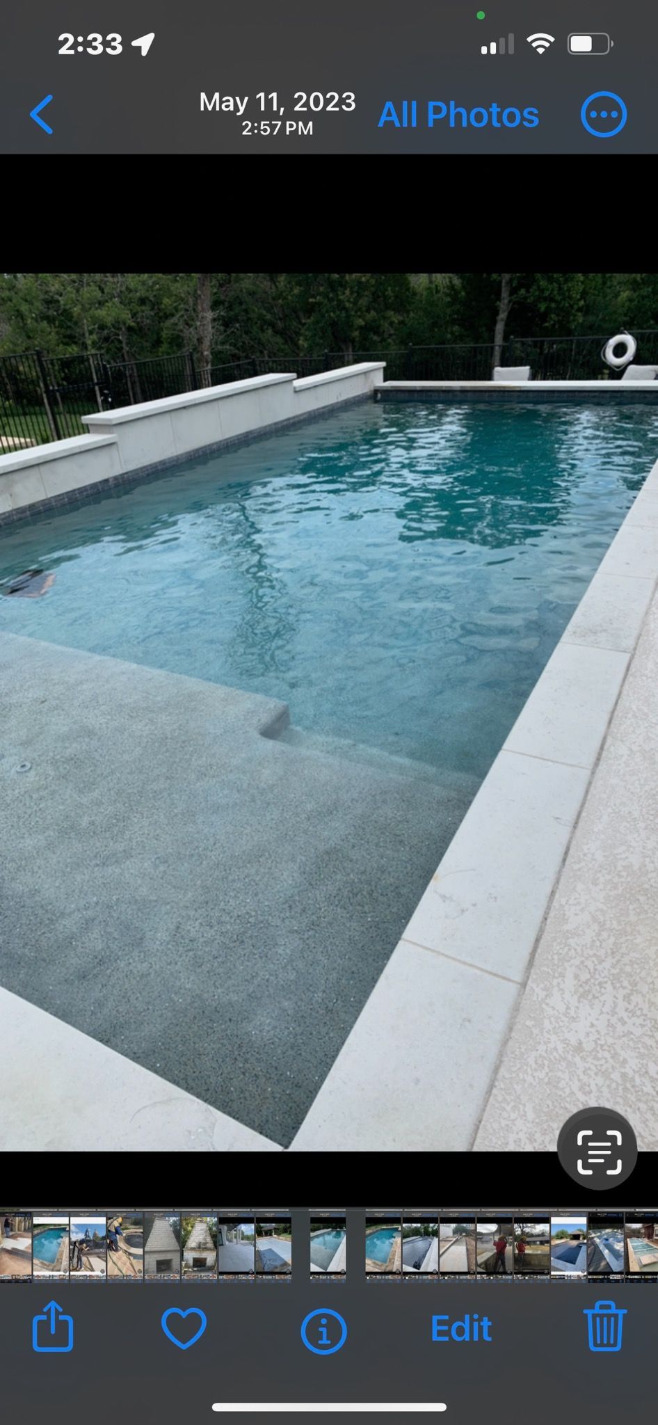 A picture of a swimming pool on a cell phone.