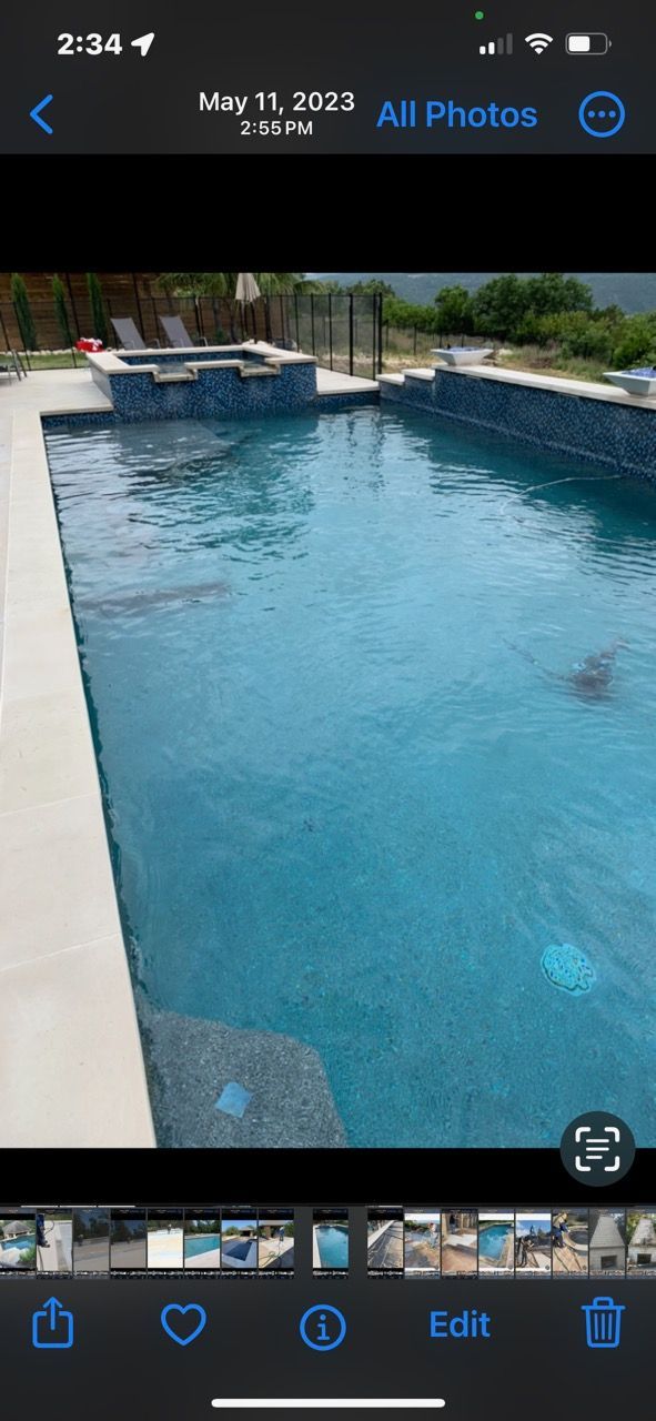 A picture of a swimming pool on a cell phone.