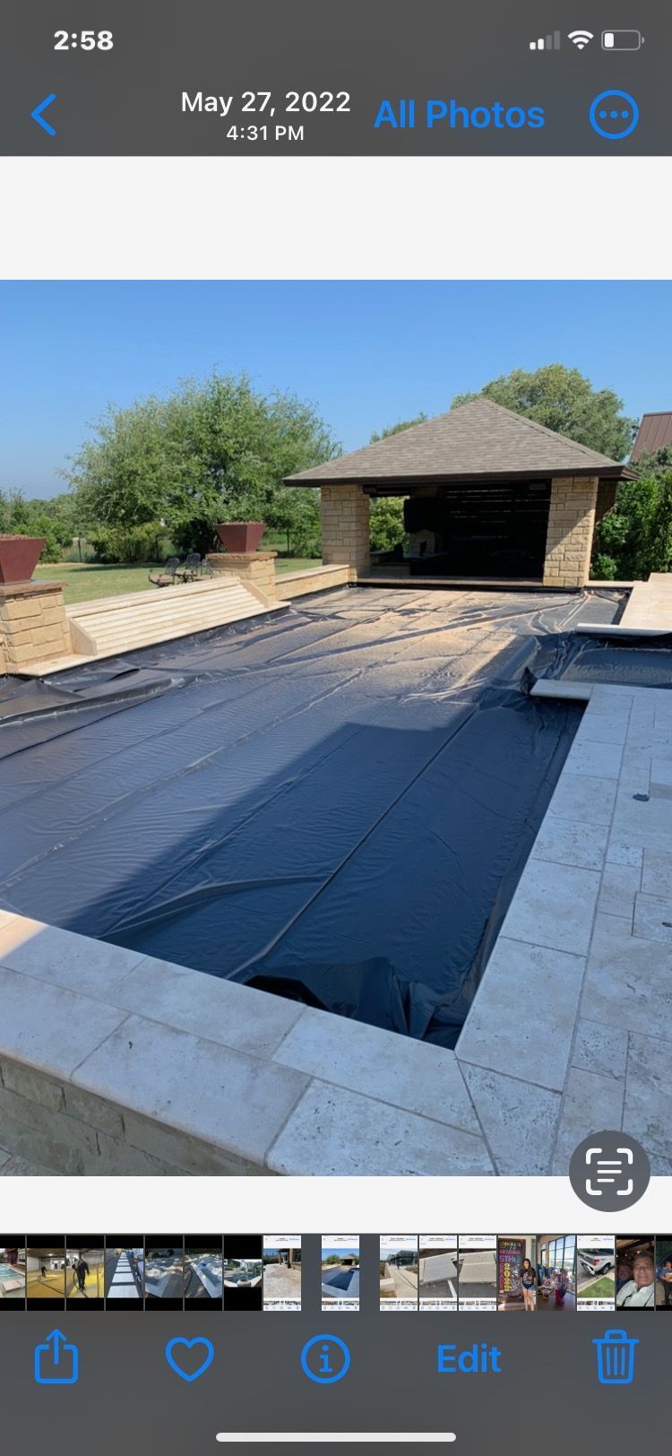 A picture of a swimming pool on a cell phone.