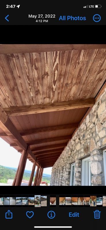 A picture of a porch with wooden beams on a phone.
