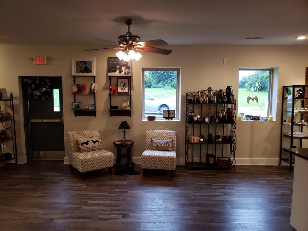 a room with two chairs and a ceiling fan