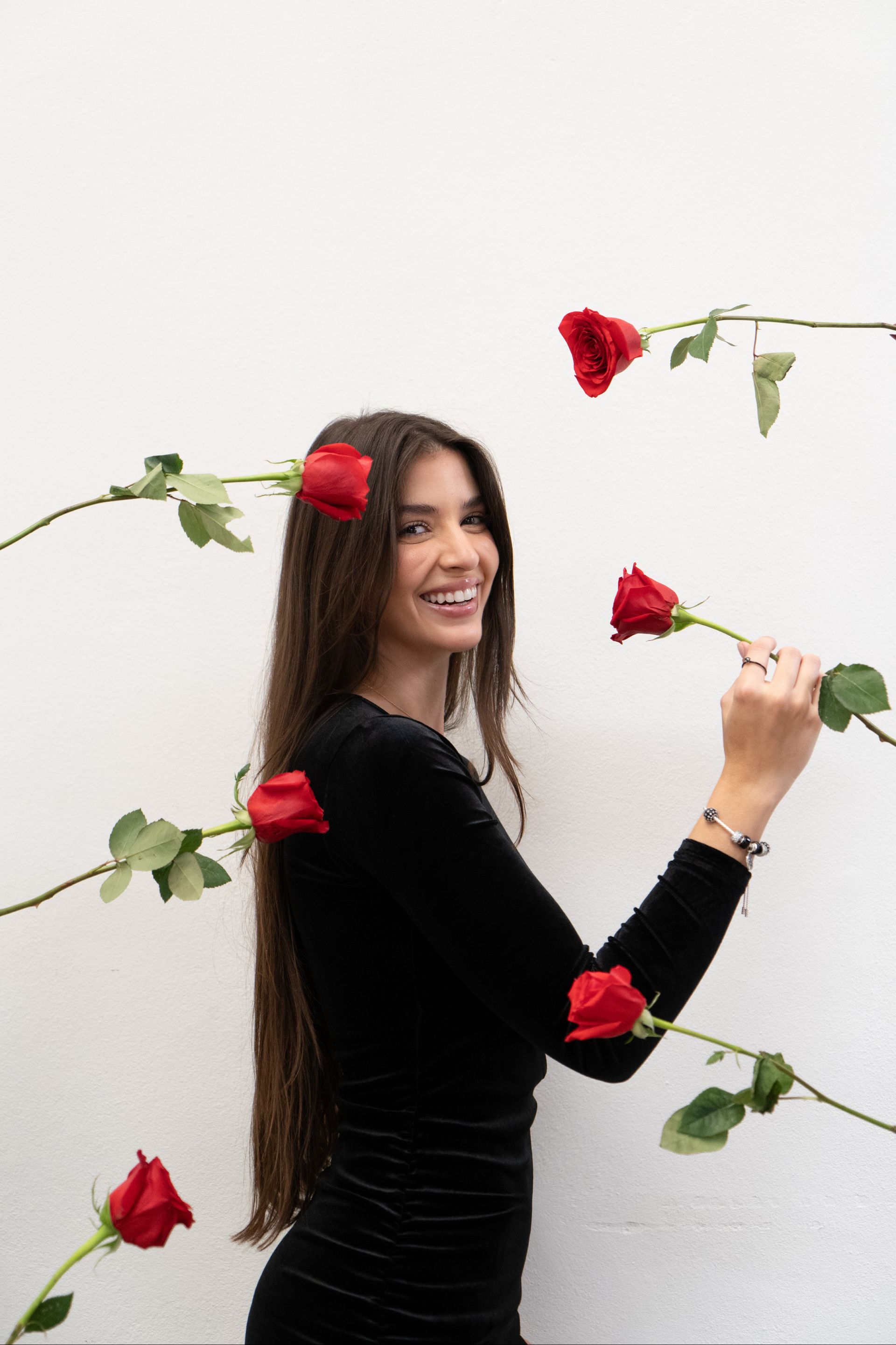 Black plate with fried food, rolled napkin, and menu with rooster illustration and