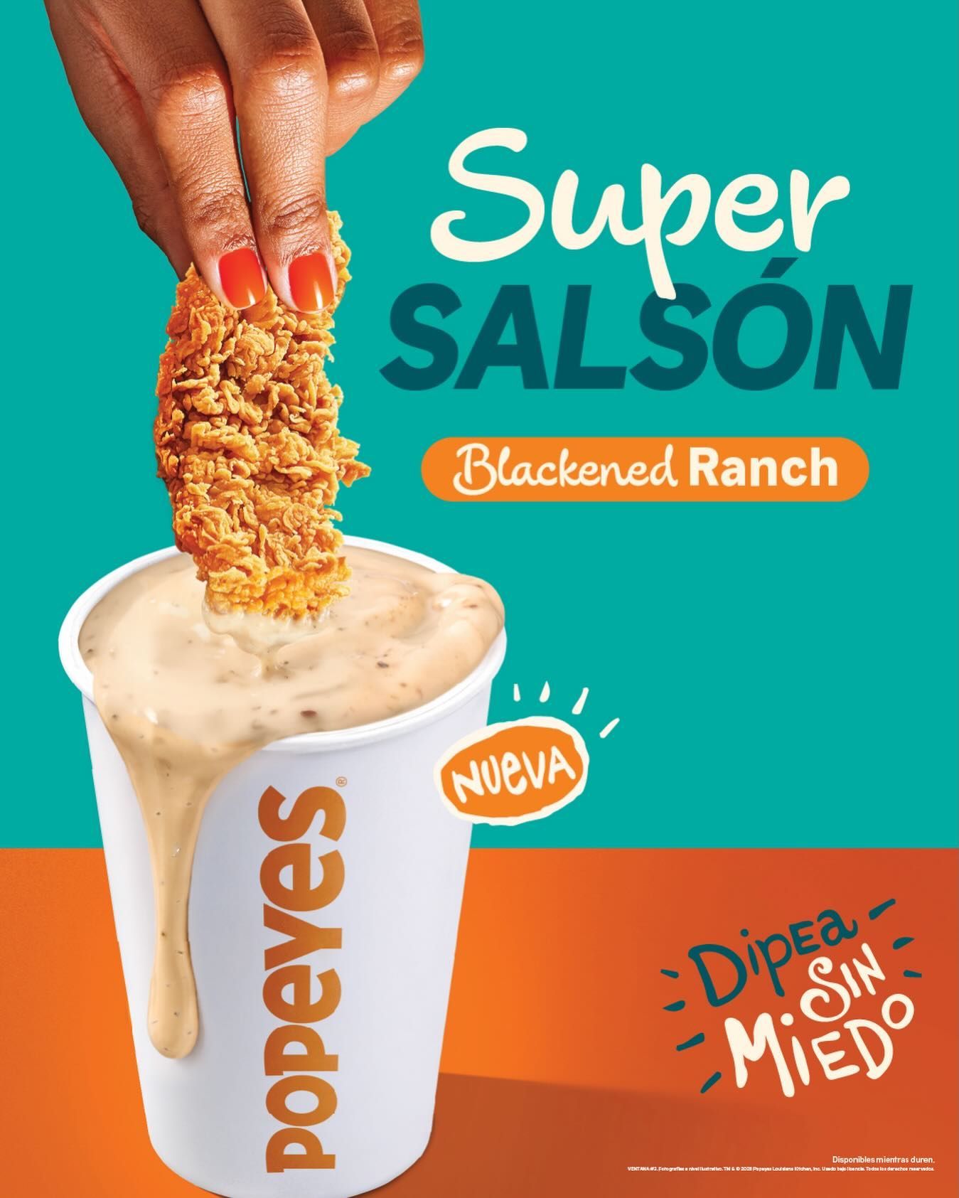 A Popeyes advertisement shows a chicken tender being dipped into a large cup of Blackened Ranch sauce.