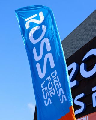 A white digital kiosk displays 