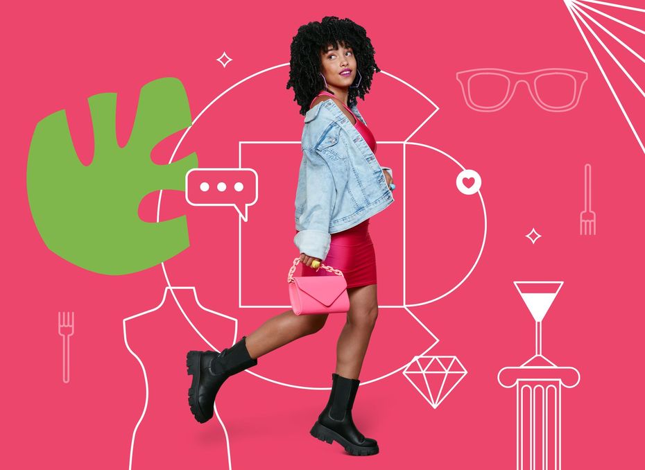 A woman in a red dress and a denim jacket is walking with a pink purse.