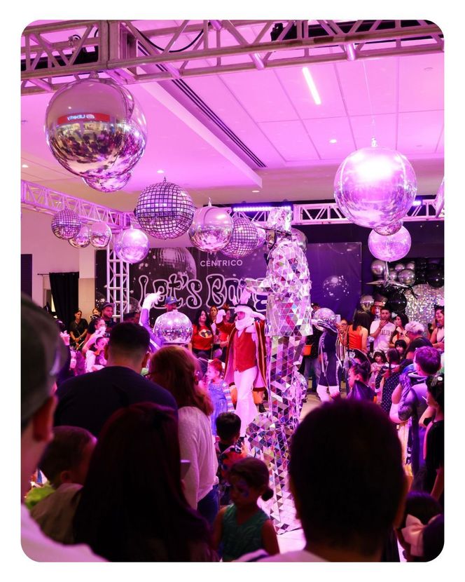 News anchors in red dresses and suit with graphics about hurricane preparedness.