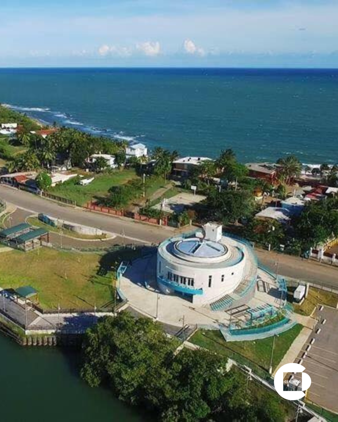 Exterior of a Marshalls store with a Rainbow store on the left, under a cloudy sky.