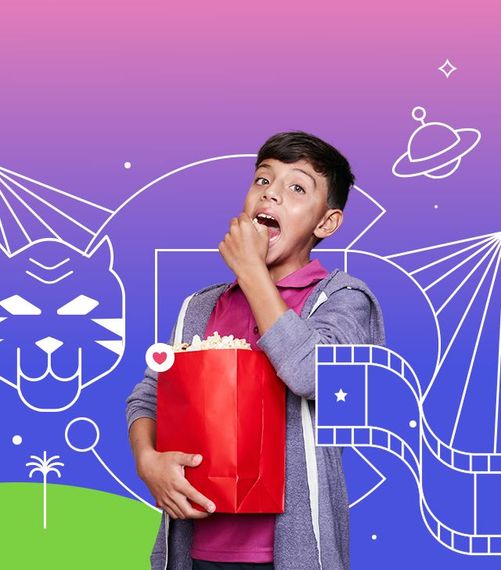 A young boy with popcorn, eating with surprise against a colorful background with film reel and a tiger drawing.