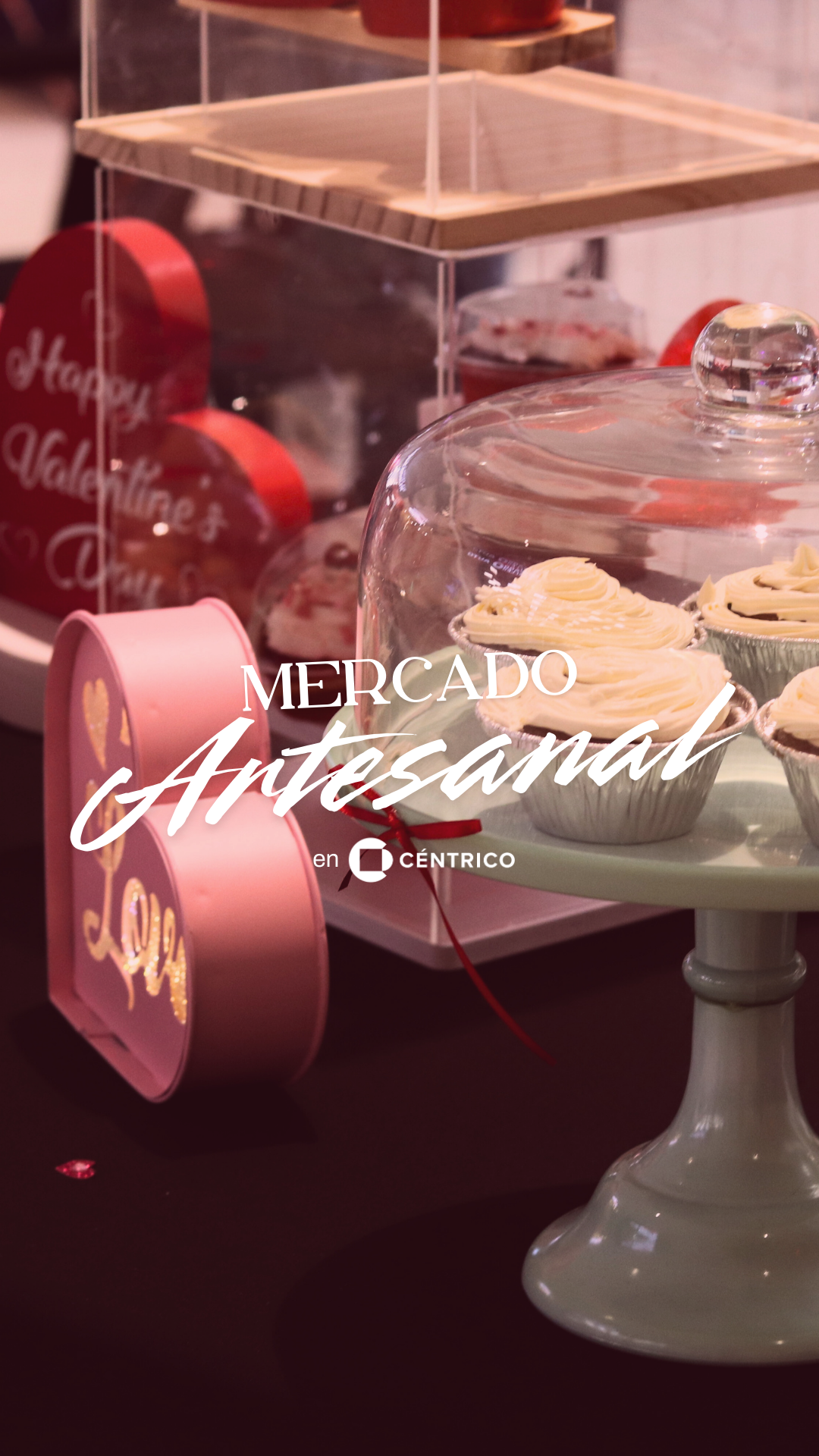 Valentine's Day treats at a market. Cupcakes on a stand, heart-shaped boxes and decor. 