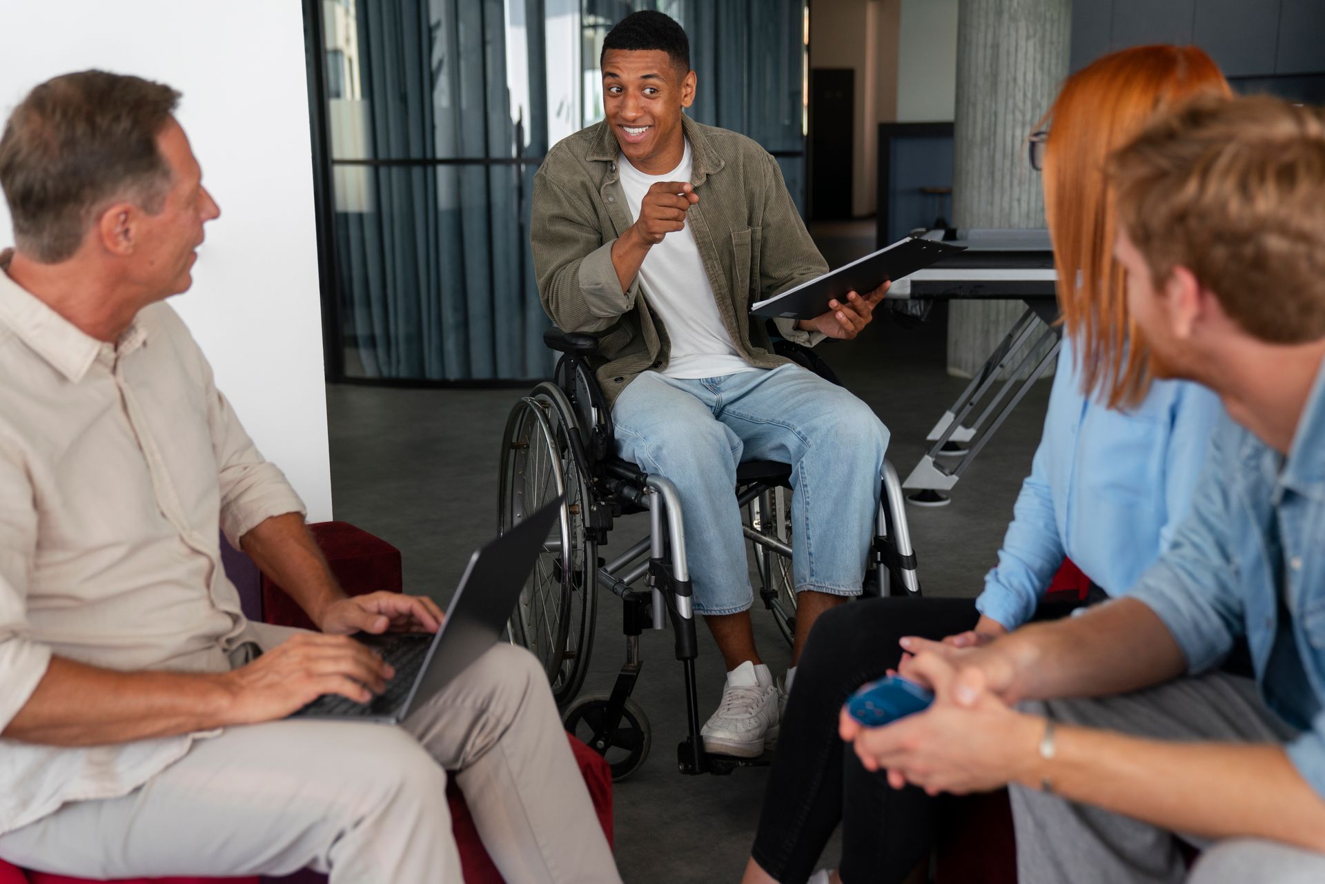 NDIS support coordinator leading a planning session with a diverse team